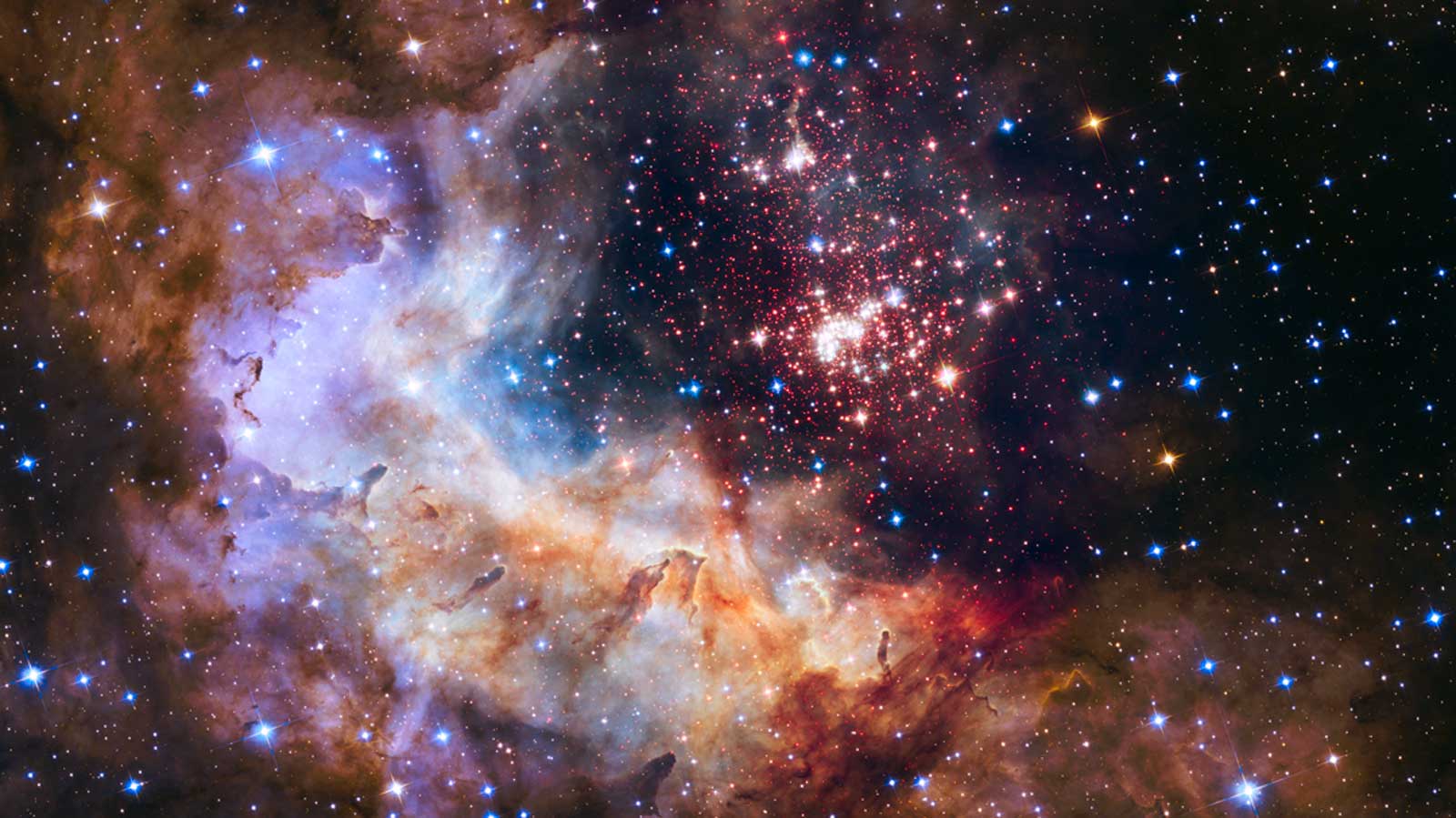 slide 5 - The brilliant tapestry of young stars flaring to life resembles a glittering fireworks display in this Hubble Space Telescope image. 